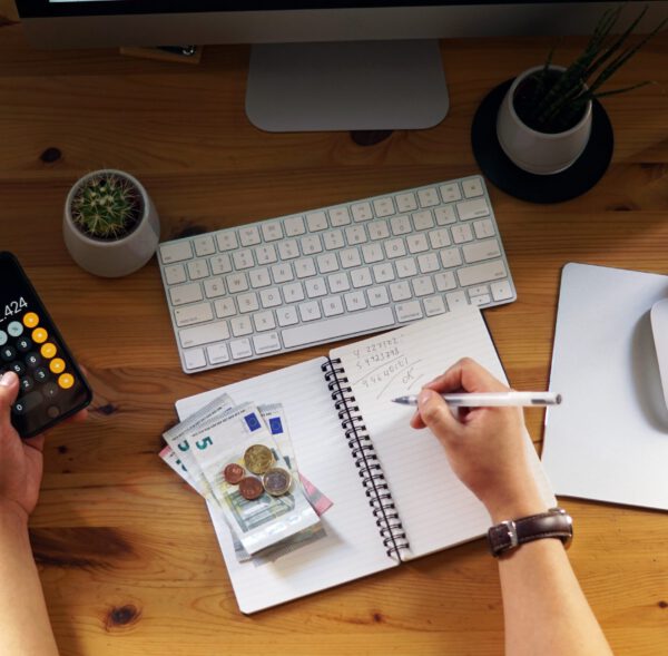 A closeup shot of an entrepreneur working from home on his personal finances and savings